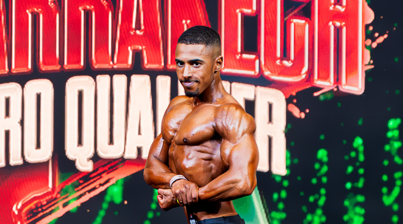 Youness, IFBB Men's Physique athlete, on stage