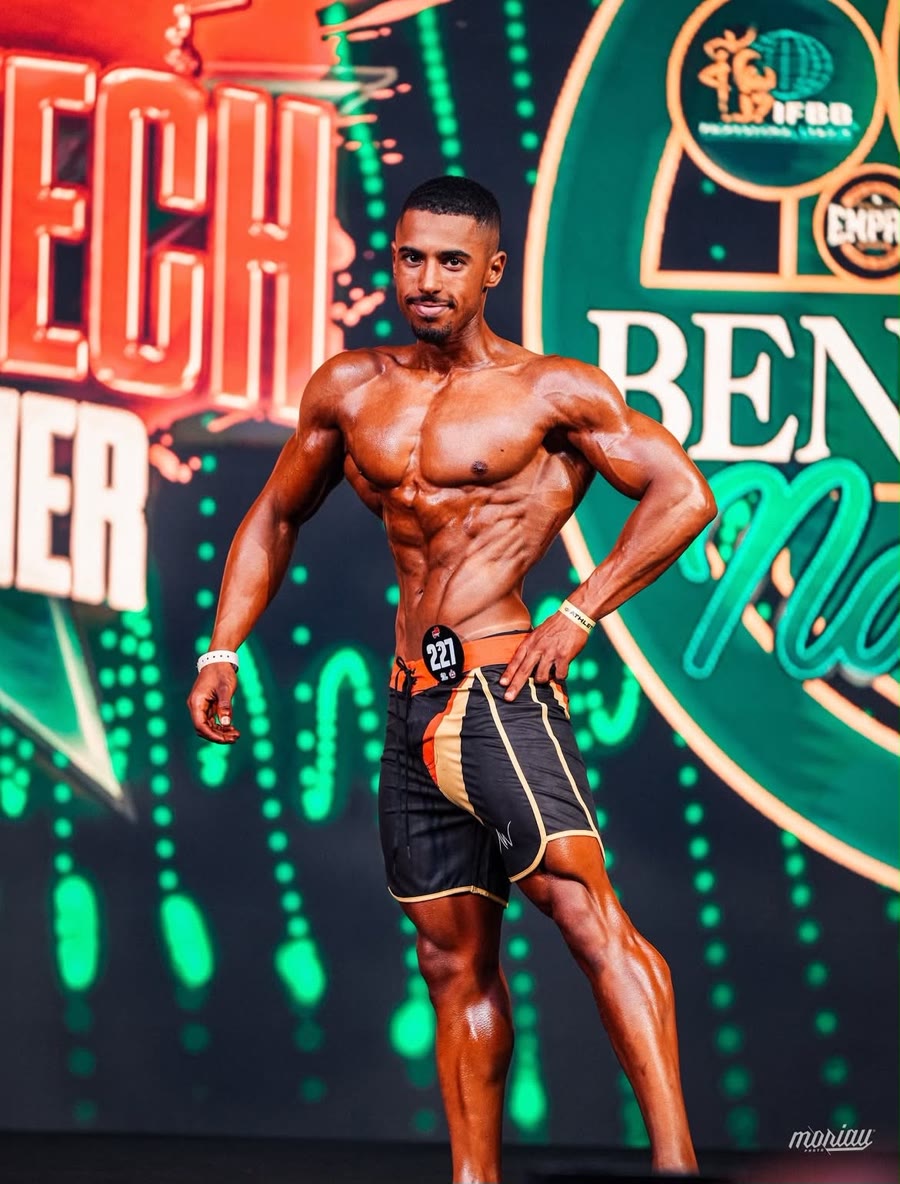 Youness posing on stage